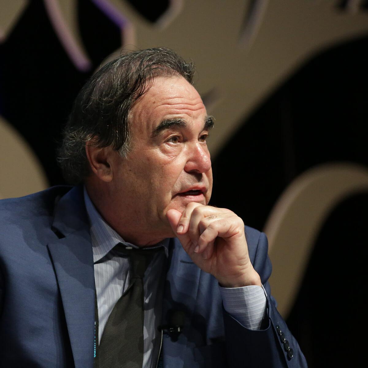 Portrait of American writer and filmmaker, Oliver Stone by photographer Julian Hanford